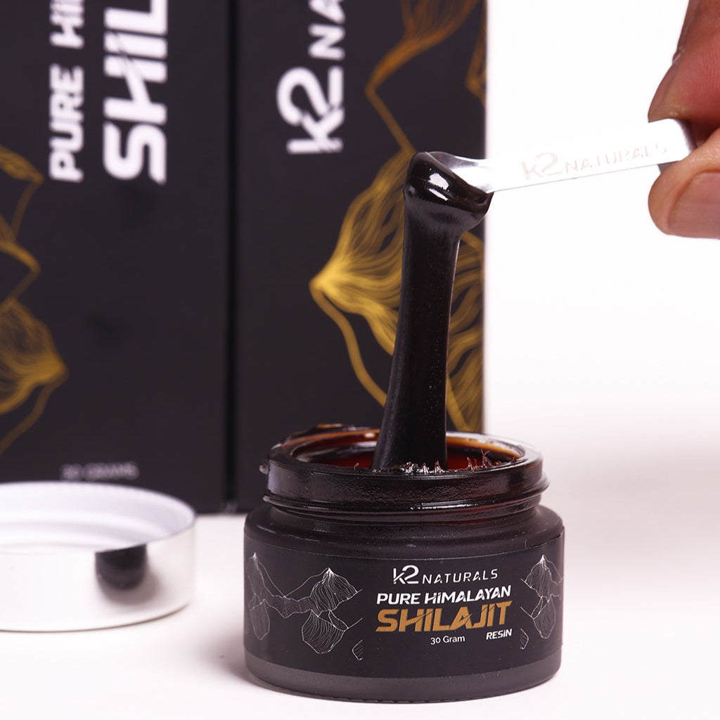 K2 Naturals Pure Himalayan Shilajit jar with a spoon scooping out resin.